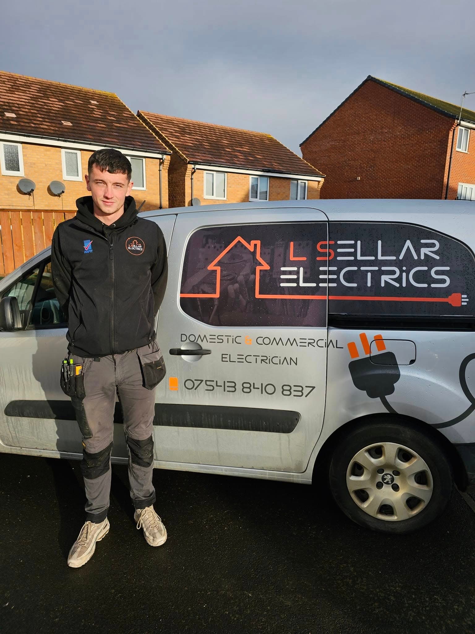 L Sellar Electrics electrician with branded service van